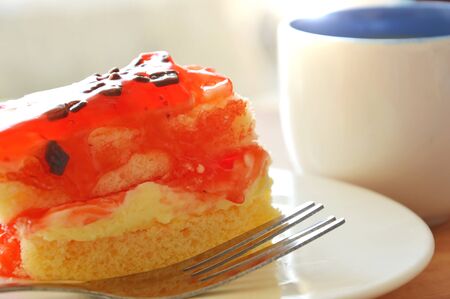 strawberry butter cake topping chocolate chip with fork and coffee cup