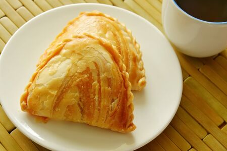 curry puff stuffed chicken and bean eat couple with tea cupの写真素材