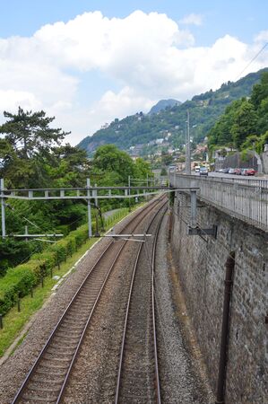 train railway beside road in Montreux Switzerlandの写真素材