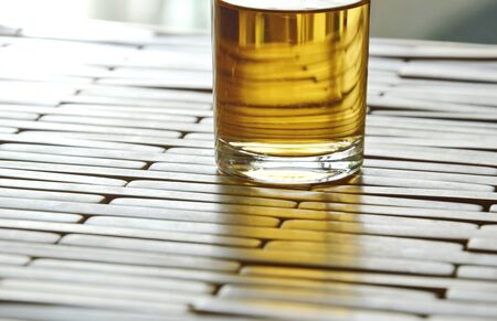 hot tea in glass shot on bamboo plateの写真素材