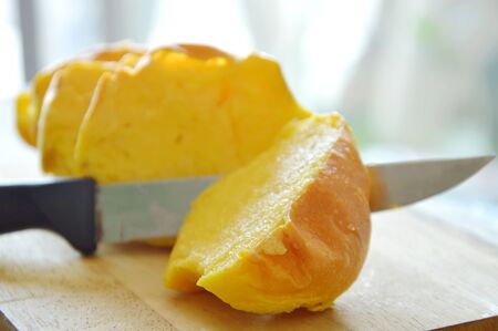 bread dressing butter and sugar slice on wooden chop plateの写真素材