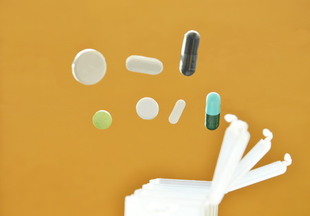 pill and capsule dropping to plastic box