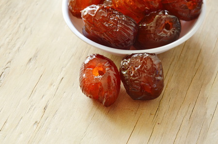 Chinese jujube candy coating syrup on little cupの写真素材