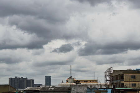 rain cloud covering building in the cityの写真素材