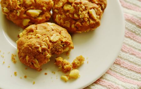 cereal butter cookie bite on white dishの写真素材