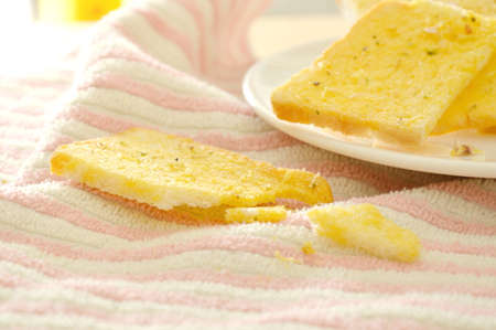 crispy butter garlic bread on dishの写真素材