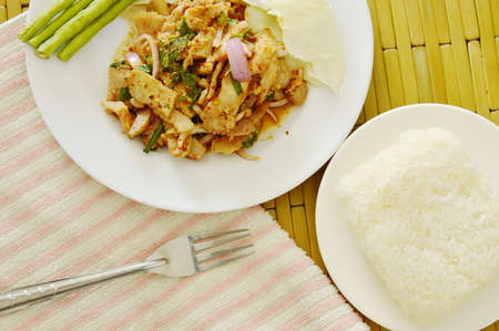 Thai spicy slice pork salad eat couple with sticky rice and fresh vegetableの写真素材
