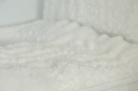 ice frosting in freezer refrigerator waiting for cleanupの写真素材