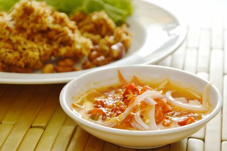 crispy fried minced catfish salad and sweet green mango sauce