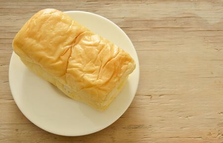 butter bread loaf on white dish