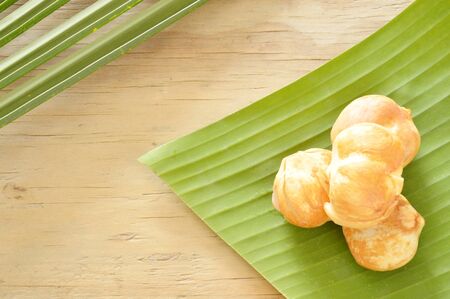 toddy palm tropical fruit on banana leafの写真素材