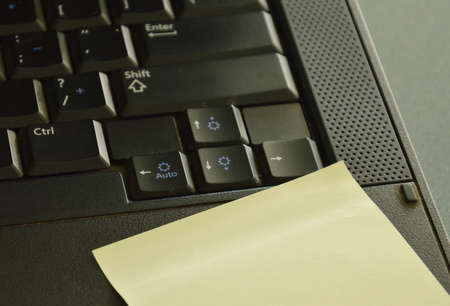 paper stick on computer notebook for note some messagesの写真素材