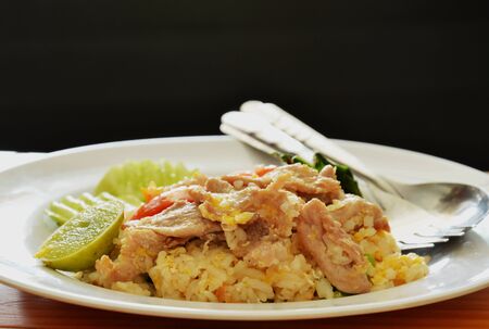 fried rice with pork and egg on dishの写真素材