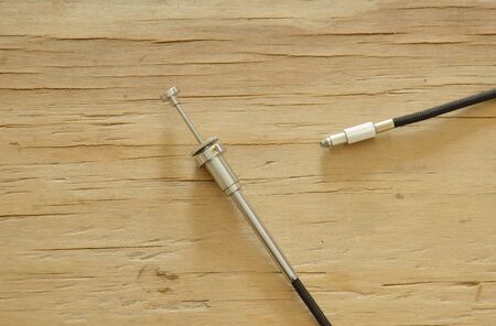 classic camera shutter cable released on wooden boardの写真素材