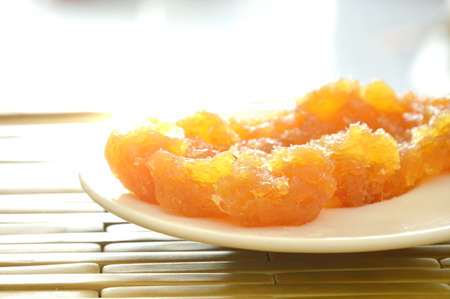preserved stir pineapple Thai sweet food on plateの写真素材