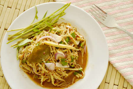 spicy slice bamboo shoot salad in Thai northeastern style on plateの写真素材