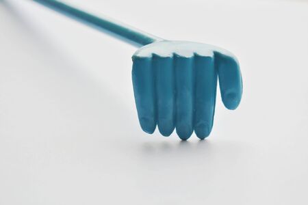 plastic scratched with long handle for back itchy on white backgroundの写真素材