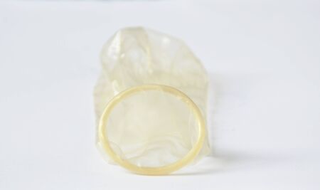 condom protection for safe sex on white background