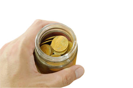 human hand holding bottle of gold coin on white background