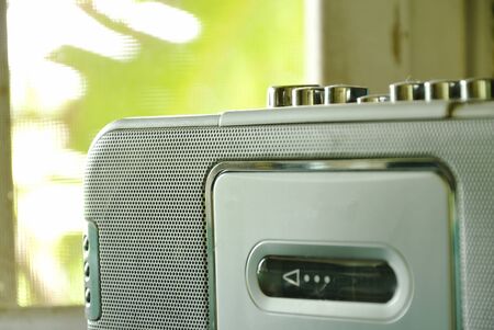 radio cassette tape recorder near window in house