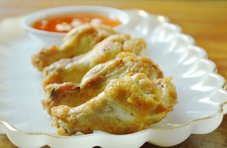 fried chicken drumsticks with salt and pepper dipping sweet chili sauceの写真素材