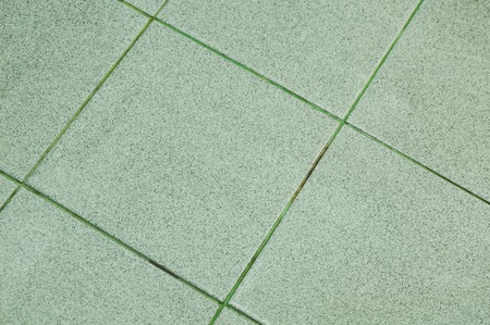 wet tile floor in bathroomの写真素材