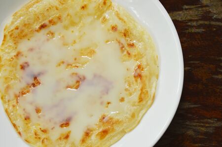 roti southern flat bread dressing sweet condensed milk on plate