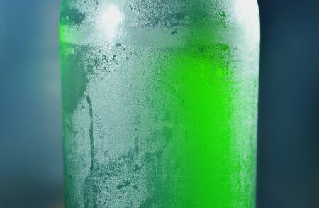 cold beer bottle with water drop on black backgroundの写真素材