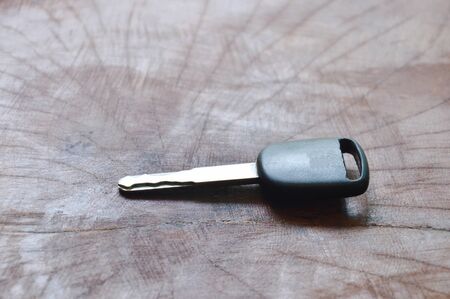 black car key on wooden tableの写真素材