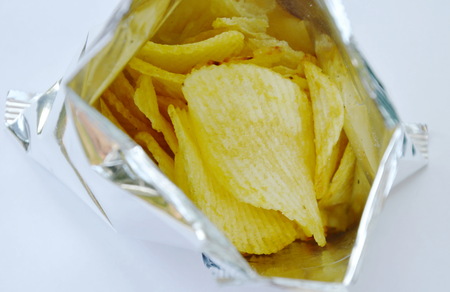 potato chip in aluminium foil packaging on white backgroundの写真素材