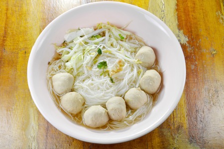 boiled rice vermicelli topping pork ball in clear soupの写真素材