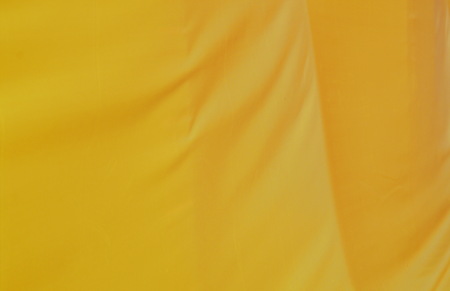 orange fabric crease background and textureの写真素材