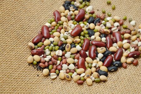 raw variety bean and cereal plant on sack