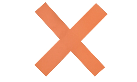 Red cross paper on white plasticの写真素材