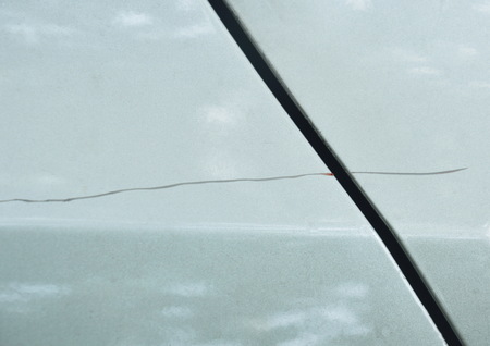 scratch from accident on silver color car background and textureの写真素材