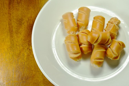 Fried pork sausage slice on dishの写真素材