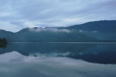 landscape of mountain with mist floating in lakeの写真素材