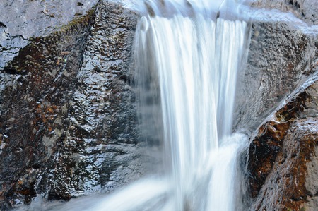 water falling on river pass rock and stone in forest