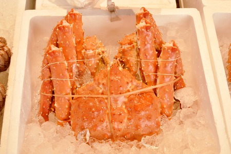 fresh giant crab displays for sale in seafood market on Supporo
