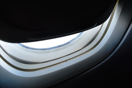 close up of plane window frame height in skyの写真素材