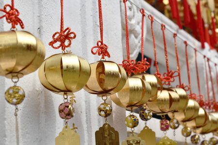 Yuchi Taiwan March 29, 2019 : golden bell donation and writing name for luck hanging on wall in Xuanguang Temple sun moon lakeのeditorial素材