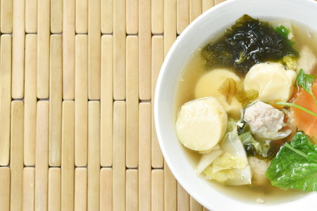 boiled egg tofu with minced pork and cabbage topping seaweed soup on bowlの写真素材