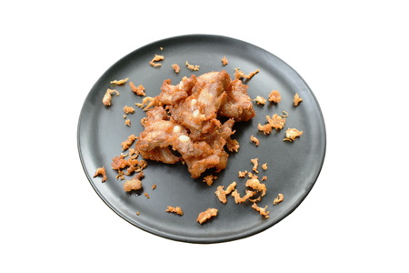 fried fermenting pork bone with crispy garlic on plateの写真素材