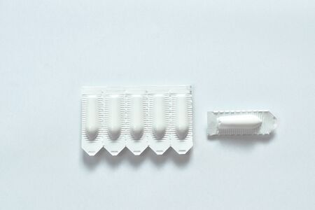 corticosteroid cream for hemorrhoid therapy used by insert in bottom hole packing on white...