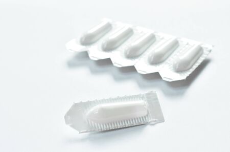 corticosteroid cream for hemorrhoid therapy used by insert in bottom hole packing on white...