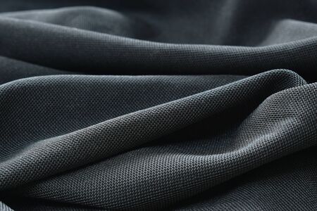 close up of black fabric background and textureの写真素材