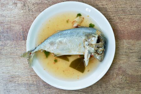 boiled mackerel spicy and sour soup on plateの写真素材