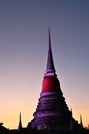 Phra Samut Chedi holy ancient pagoda with red robe on twilight sky in Thailandの写真素材
