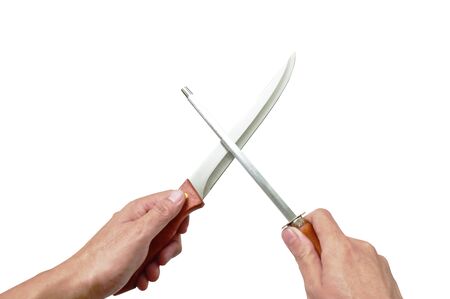 hand holding kitchen knife with sharpening steel on white background