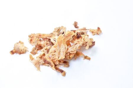 baked dry salty squid slice arranging on white backgroundの写真素材